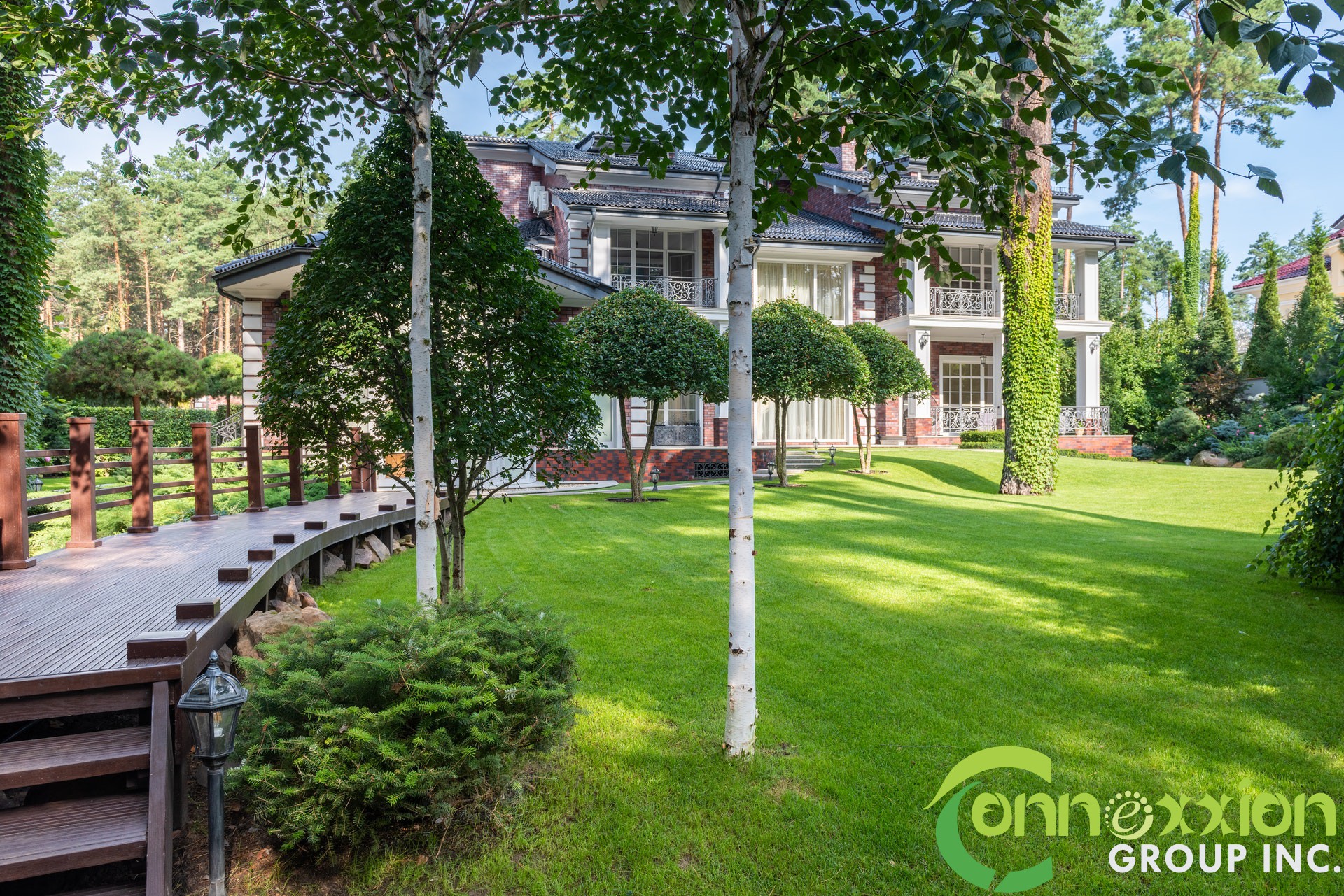 Garden with path near plants and trees near river