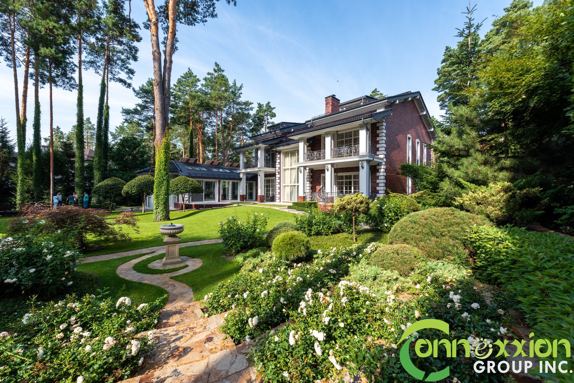 Garden with path near plants and trees near river